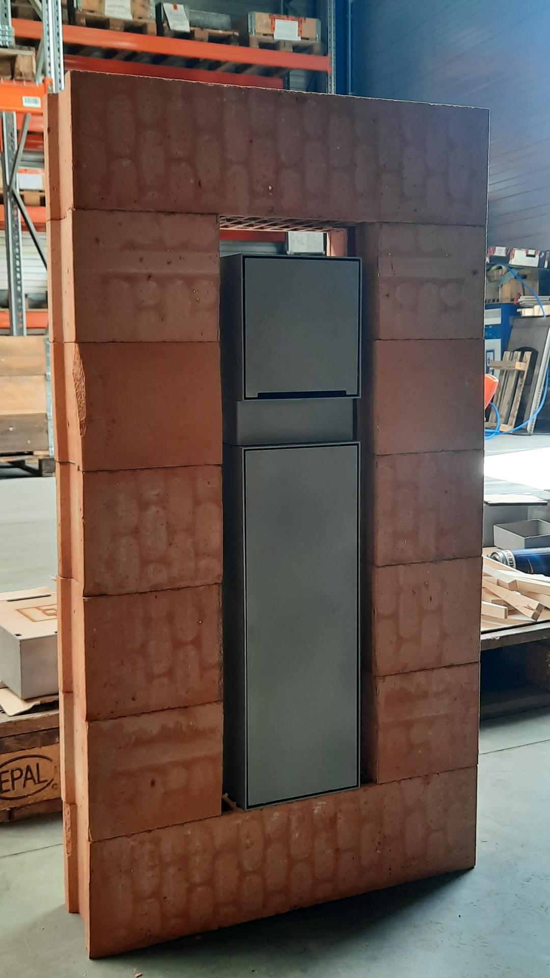 HIDN prototype recessed into a brick wall test panel in the workshop