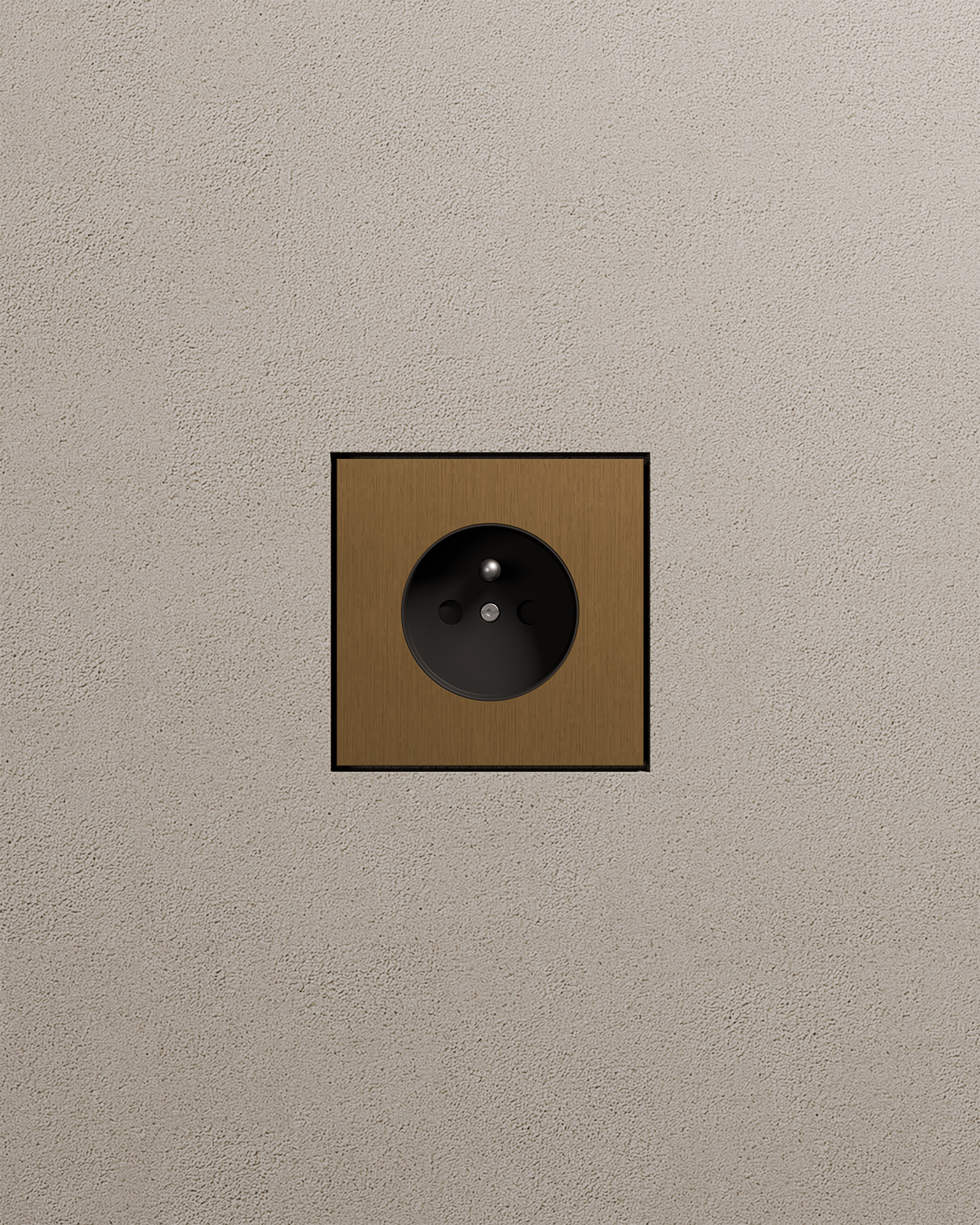 VisibleV single socket in old brass finish on a textured plaster wall