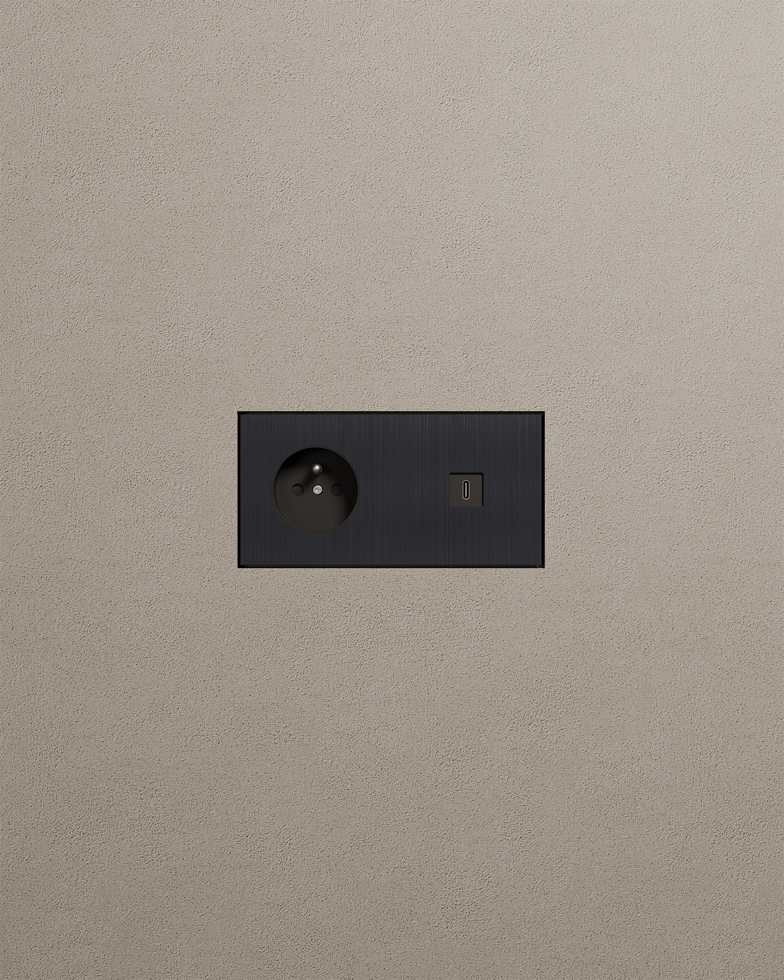 VisibleV socket and USB-C port in steel blue finish on a textured plaster wall