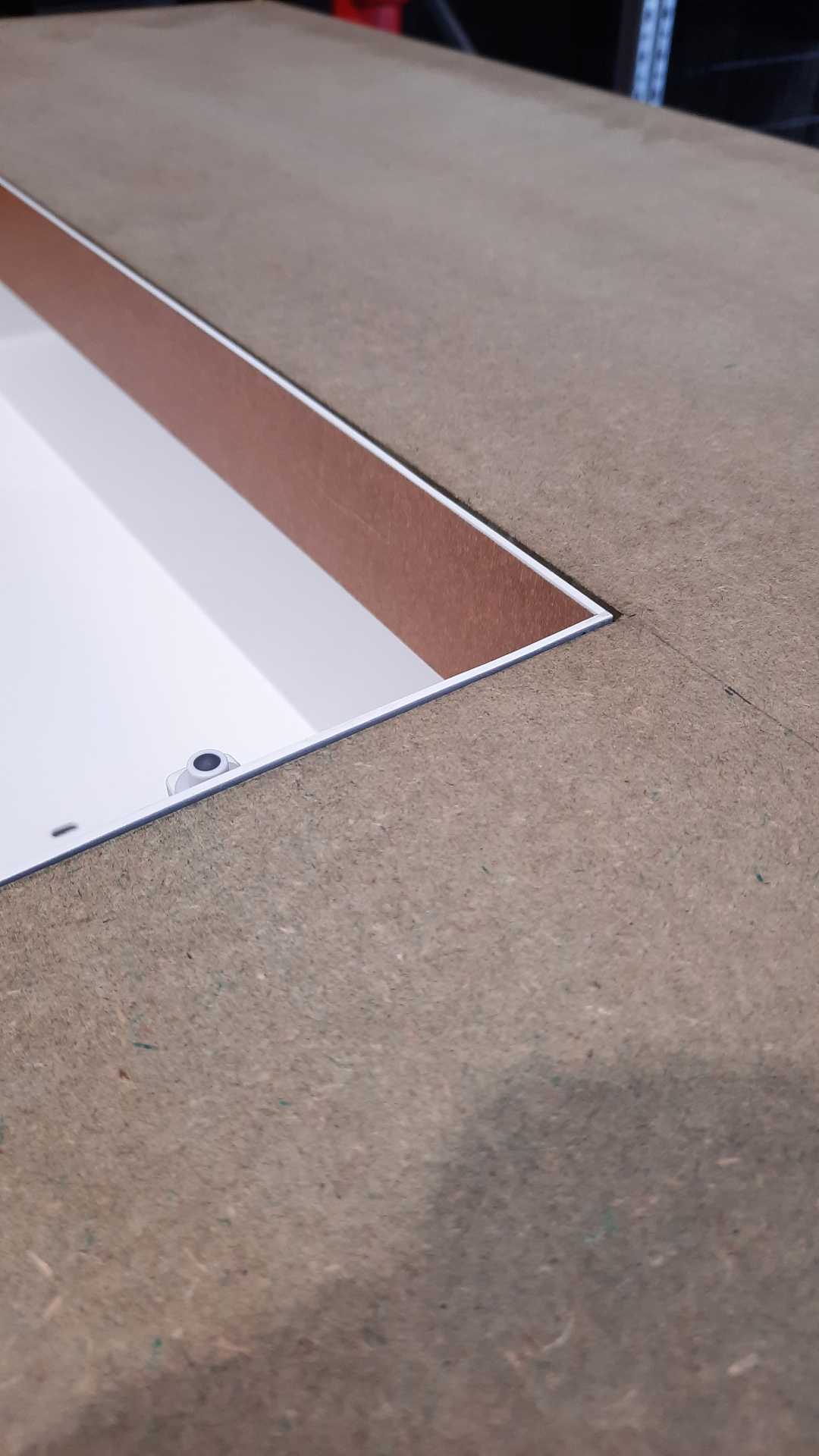Close-up of the HIDN fair stand wall with a recessed cut-out being finished